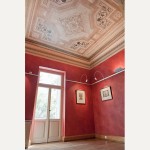 Each room is unique, with richly colored walls and restored ceiling paintings
