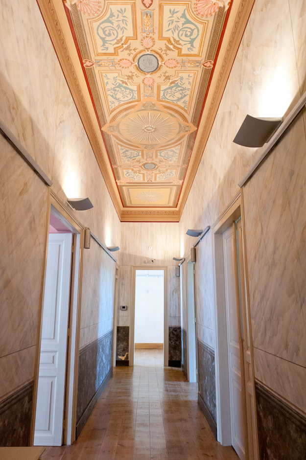 The second floor corridor is also features restored hand painted walls and ceilings